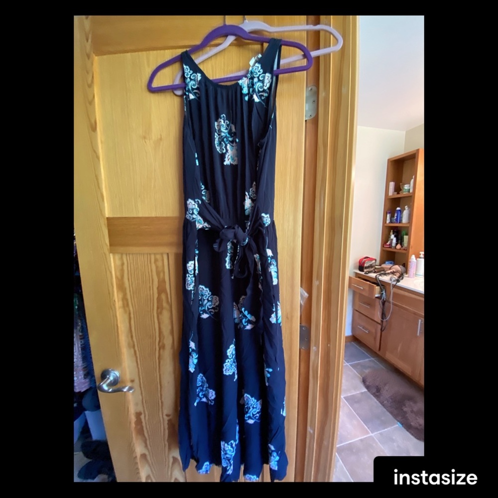 New York and Company navy and floral belted jumpsuit.